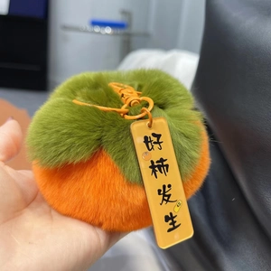 Portachiavi in peluche a forma di cachi arancione con foglie verdi e gancio in metallo