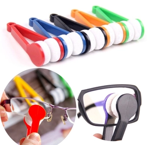 Portable microfiber eyeglass cleaning tools in five colors shown in use and flat lay