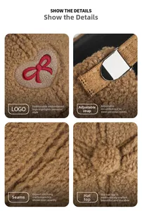 Close-up of heart bow embroidery and metal buckle on brown lamb wool baseball cap