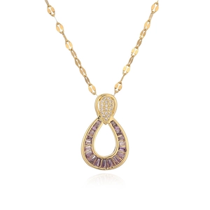 Detail of gold teardrop pendant with purple baguette zircon and white crystal stones