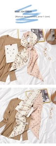 Detailed view of long French style silk twilly scarf with cute rabbit floral pattern print