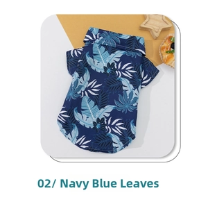 Detail of navy blue Hawaiian pet shirt with tropical leaf print and small collar