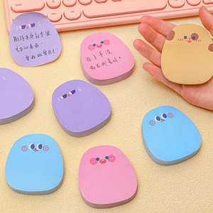 Macro shot of colorful cartoon sticky notes in macaron shades with cute facial expressions