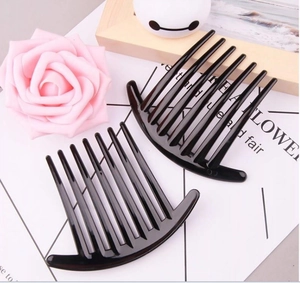 Close-up of black 8-tooth hair side combs set for French twist hairstyling