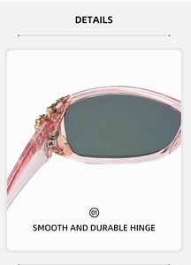 Detailed macro view of durable smooth hinge with gold metal and rhinestone on pink sunglasses