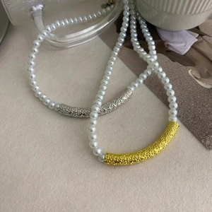 French style pearl beaded necklace with textured gold and silver metal bar accents