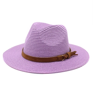 Detailed close-up of purple straw fedora hat featuring a brown suede band and gold buckle