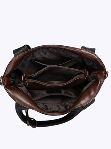Brown leather tote bag interior view showing multi-layer compartments and zipper pockets