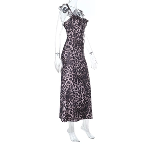 Detail of leopard print maxi dress showing ruffled V-neckline and slim-fit silk texture