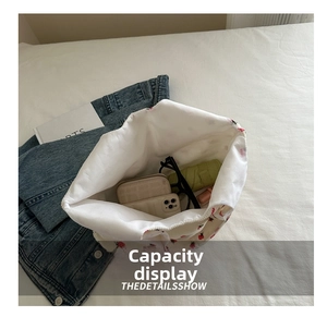 Detail view of large strawberry print canvas tote bag showing interior storage capacity