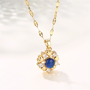 Golden titanium heart pendant necklace with blue temperature-sensitive stone and rhinestones