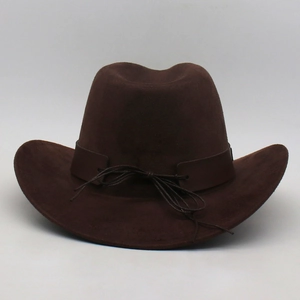 Detail of a dark brown western cowboy hat featuring a leather strap and classic creased crown