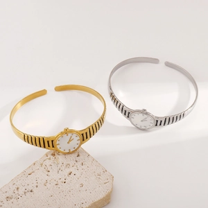 Fashionable watch-style open cuff bracelets with textured strap design in gold and silver