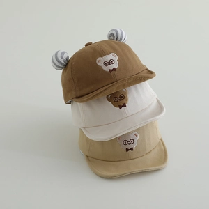 Cute bear embroidered baby baseball caps in brown, cream, and khaki cotton fabric