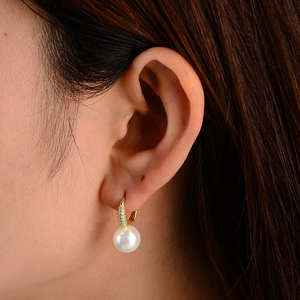 Elegant sterling silver earrings with large white pearls and sparkling zircon accents
