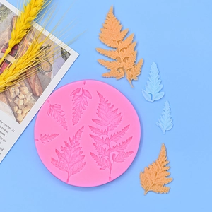 Pink silicone fern leaf mold for fondant cake decoration with tropical plant patterns