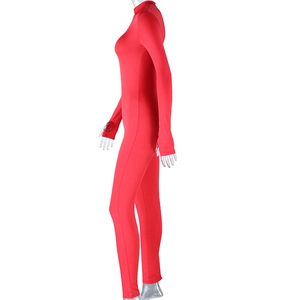 Detail of red high-elasticity bodysuit showing the stand-up collar and long sleeve fit