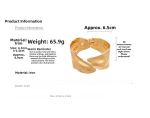 Detail showing irregular wavy texture and dimensions of the golden metal wide bangle