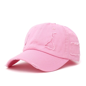 Pink distressed baseball cap with ripped hole detailing and frayed edges in cotton canvas