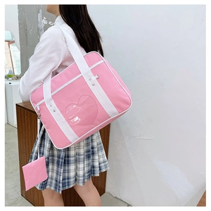 Pink JK uniform bag with heart-shaped clear window and matching mini coin purse detail