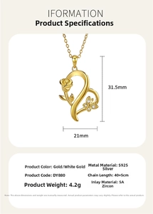 Detail shot of S925 silver heart pendant with rose, zircon butterfly and gold finish