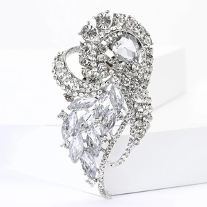 Close-up of vintage silver alloy brooch with sparkling rhinestones and crystal detail