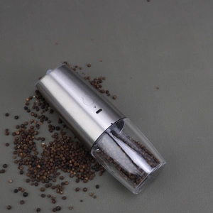 Detail of electric pepper grinder with USB-C charging port and stainless steel body