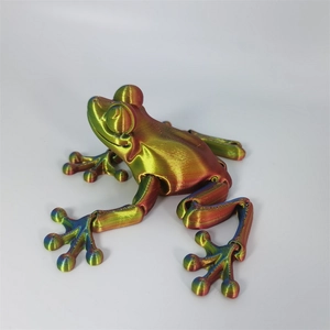 Macro view of 3D printed articulated frog with vibrant rainbow color gradient finish