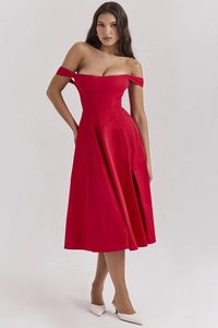 Detail view of red floral satin midi dress featuring a side slit and corset bodice