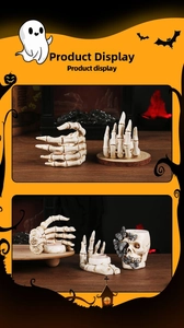 Detail of skull hand resin candle holders and skeleton decor for Halloween party ornaments