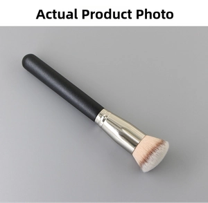Close-up of flat top foundation brush with pink gradient bristles and black matte handle