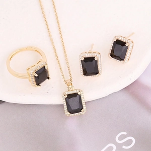 Luxurious gold necklace set with rectangular black gemstone pendants and micro-pave zircons