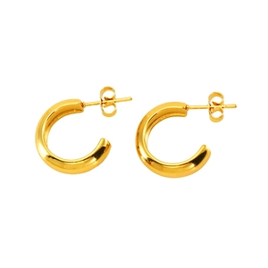 Detailed view of gold-plated C-shaped stainless steel hoop earrings with polished finish