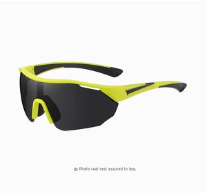 Detail of neon yellow cycling sunglasses with black wraparound lens and non-slip nose pads
