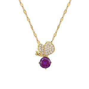 Luxurious gold necklace featuring a purple gemstone and diamond butterfly pendant