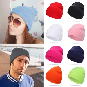 Classic unisex solid color knitted beanies for winter warmth in various vibrant colors