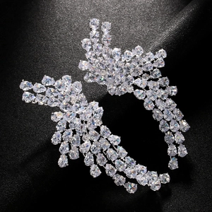 Luxury silver wing earrings with sparkling cubic zirconia stones in elegant droplet design