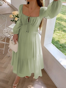 Light green long-sleeved midi dress with square neck and layered ruffle skirt design