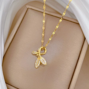 Titanium gold leaf pendant necklace with crystals on silk background for women