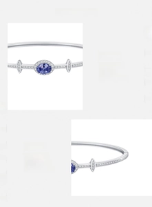 Detail of S925 silver bracelet featuring oval blue zircon and white sparkling stones
