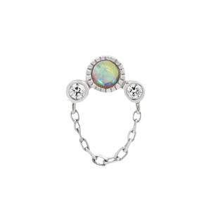 Macro detail of S925 sterling silver opal earring with dangling chain and zircon