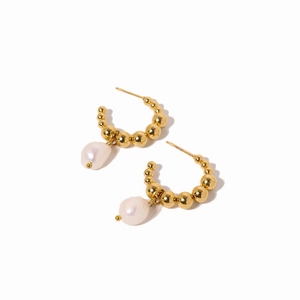Elegant gold beaded C-shape hoop earrings featuring baroque pearl charms on white background