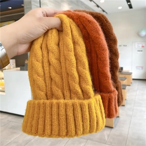 Thick cable knit beanie for winter in yellow, orange and brown colors for women and men