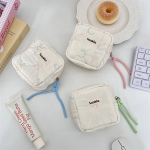 Soft quilted cotton mini portable storage pouch for sanitary pads with pastel zipper pulls