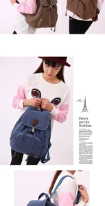 Detailed view of canvas backpack with leather accents in coffee and blue colors