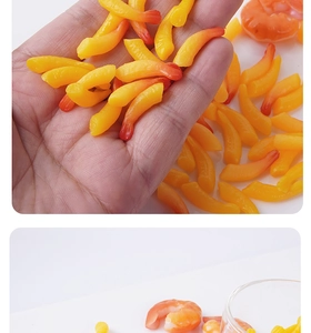 Detailed view of mini artificial tempura shrimp models for DIY crafting and food play props