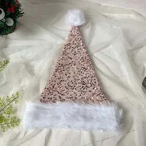 Detail of pink sequins Christmas hat with white faux fur trim on a textured surface