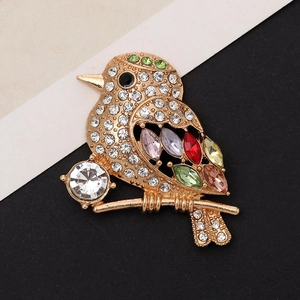 Zinc alloy bird charm with multicolored crystals and rhinestones on a split background