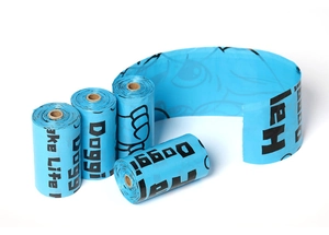 Detail of blue biodegradable dog waste bags showing textured finish and rolls