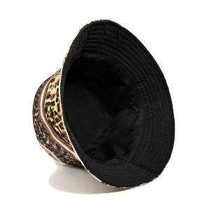 Reversible bucket hat featuring stylish leopard print and solid black lining for sun protection